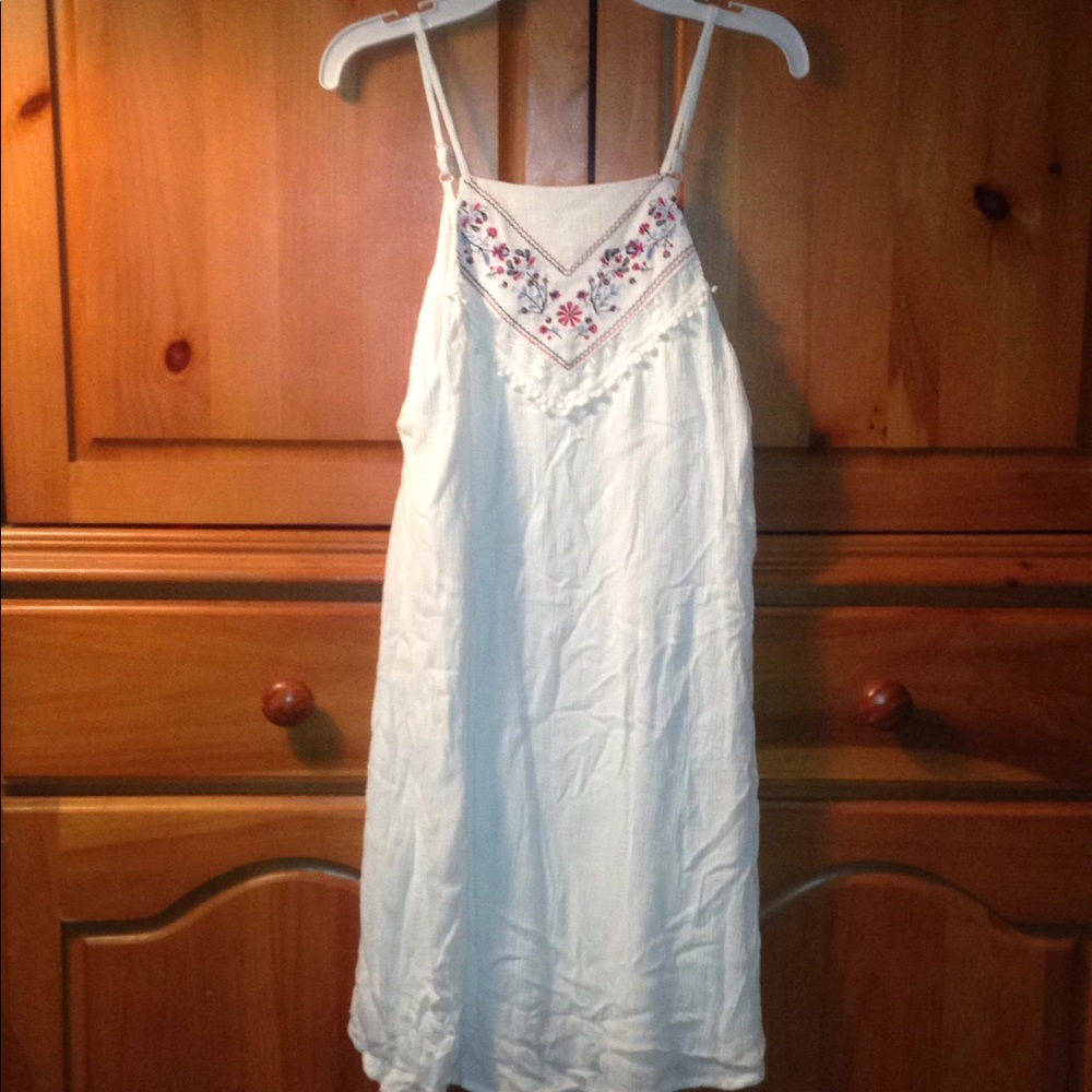 White dress with flowers at the neck line